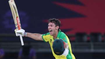 Australia's Mitchell Marsh run towards teammate Glenn Maxwell to celebrate after winning the Cricket