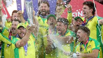Australia's captain Aaron Finch raises the trophy with his teammates after they won the Cricket Twen