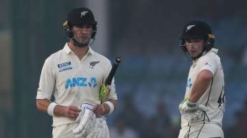 New Zealand's batsmen Tom Latham, right, and Will Young talk during Day 2 of the 1st Test against In