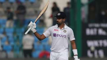 India's Shreyas Iyer raises his bat after scoring fifty runs during the day four of their first test