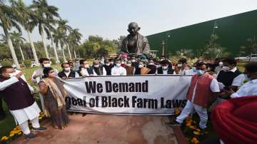 New Delhi: Congress President Sonia Gandhi, party leader Rahul Gandhi and others stage a protest demanding repeal of Centres three farm laws at Parliament House ahead of the Winter Session, in New Delhi