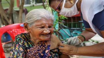 A health worker administers a dose of COVID-19 vaccine to an elderly woman in Chennai.