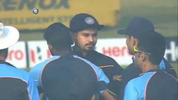 Shreyas Iyer (centre) is congratulated by India teammates after receiving his maiden Test cap from S