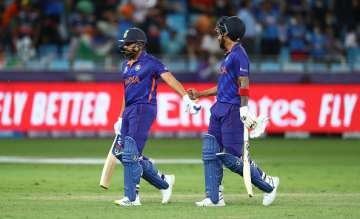 Rohit Sharma of India interacts with team mate KL Rahul after being dismissed during the ICC Men's T