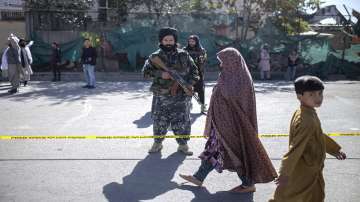 Taliban fighters stand guard after an explosion in Kabul, Afghanistan, Wednesday, Oct.20, 2021. (AP Photo/Ahmad Halabisaz)