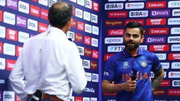 Virat Kohli of India looks on as they are interviewed following the ICC Men's T20 World Cup match be
