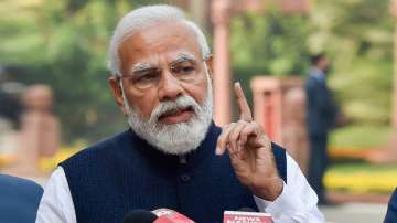 Prime Minister Narendra Modi addresses media as he arrives at Parliament to attend the Winter Session on Nov. 29, 2021.