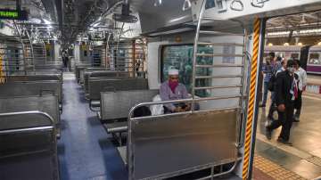 A passenger sits inside an air-conditioned local train of the Central Railways at Chatrapati Shivaji Maharaj Terminus (CSMT) in Mumbai.