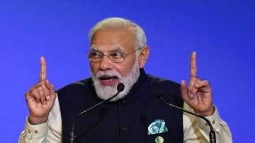 Prime Minister Narendra Modi gestures as he makes a statement at the COP26 U.N. Climate Summit in Glasgow, Scotland.