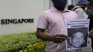 Activists attend a candlelight vigil against the impending execution of Nagaenthran K. Dharmalingam, sentenced to death for trafficking heroin into Singapore, outside the Singaporean embassy in Kuala Lumpur