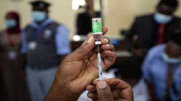 A nurse prepares to administer a dose of the AstraZeneca COVID-19 vaccine.