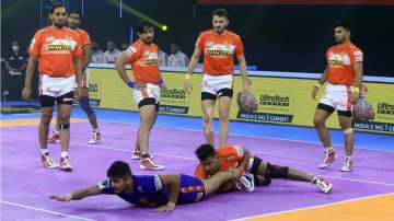 Naveen Kumar claiming the last raid point of the match.