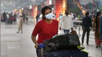 Passengers at the Terminal 3 of the IGI Airport to board a flight in New Delhi on Nov 8.