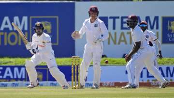 Sri Lankan batsman Dhananjaya de Silva (far left) plays a shot during the fourth day of second Test against West Indies in Galle on Thursday.