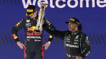 Mercedes driver Lewis Hamilton celebrates winning the Saudi Arabian GP in front of rival and second-