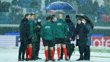 Referees stand on the pitch prior to the Champions League group F match between Atalanta and Villarr