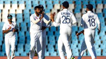 India's bowler Jasprit Bumrah celebrates with teammates after taking wicket of South Africa's batsma