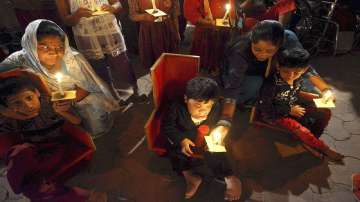 Victims of the Bhopal Gas Tragedy take part in a candle light vigil to mark the anniversary of the tragedy. 
 