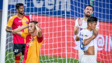 East Bengal players (left) and their Kerala Blasters counterparts look dejected at the end of their 