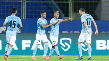 Mumbai City FC team celebrating a goal during the match against ATK Mohun Bagan