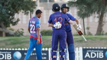 Raj Bawa and Kaushal Tambe celebrate India's win over Afghanistan in the Under 19 Asia Cup. 