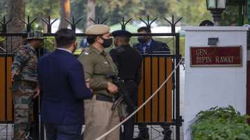 A police person guards outside the residence of Chief of Defense Staff Bipin Rawat in New Delhi.