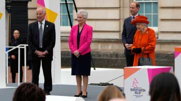 Britain's Queen Elizabeth II (R), Louise Livingstone Martin head of the Commonwealth Games 