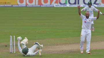 Pakistan's Sajid Khan (front right) celebrates after the dismissal of Bangladesh's captain Mominul H