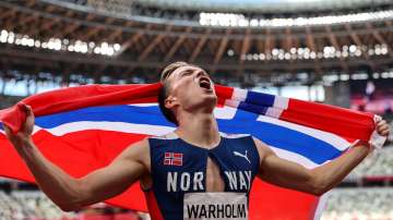 Karsten Warholm of Team Norway celebrates winning the gold medal in the Men's 400m Hurdles Final.