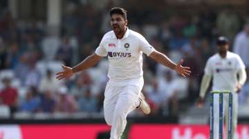 Shardul Thakur celebrates after taking a wicket of England batsman.