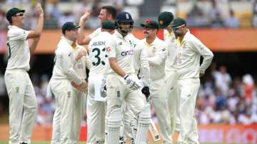 England captain Joe Root (centre) looks dejected after losing his wicket during day one of the First Ashes Test Match against Australia at The Gabba in Brisbane on Tuesday.