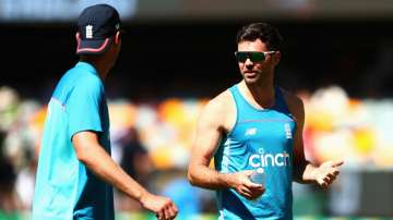 Stuart Broad of England and James Anderson of England engage in discussion during practice session