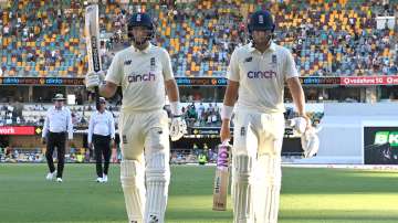 Joe Root and Dawid Malan of England are seen leaving the field after day three of 1st Test
