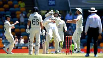 Nathan Lyon of Australia celebrates taking his 400th test wicket after dismissing Dawid Malan 