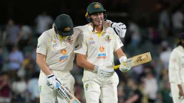 Australia's Steve Smith (left) and Marnus Labuschagne walk off the field at stumps on Day 1 of the A