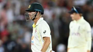 Australia's David Warner walks off the field after being run out by England's Stuart Broad for 13 runs during Day three of the second Ashes Test at the Adelaide Oval on Saturday.