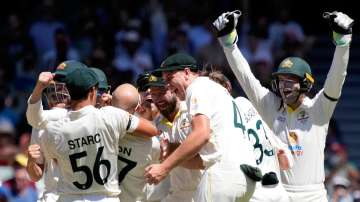 Australian players after winning a DRS review of the wicket of Ben Stokes on Day five of the Second Ashes Test against England at the Adelaide Oval on Monday.