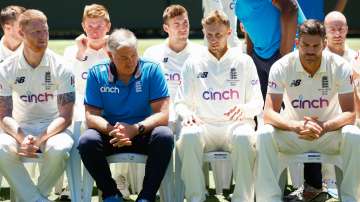  England head coach Chris Silverwood speaks to Joe Root of England before posing for a team photo du