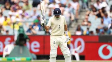 Joe Root of England raises his bat after scoring a half century during Third Test match in the Ashes