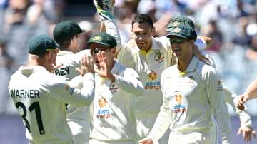 Scott Boland of Australia celebrates with teammates after dismissing Jonny Bairstow of England 