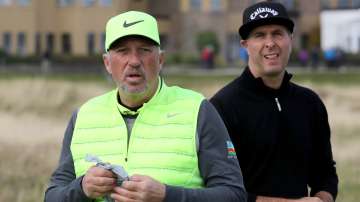 Sir Ian Botham with Michael Vaughan on the first hole at The Old Course. ( File Photo)