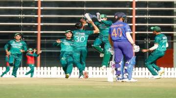 Pakistan cricket team celebrating wicket of an Indian batsman. 