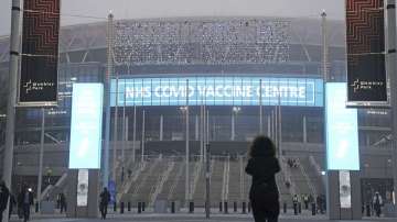 A view of the exterior of Wembley Stadium in London, which is being used as a vaccination centre, as the coronavirus booster vaccination program is ramped up Sunday Dec 19, 2021. 