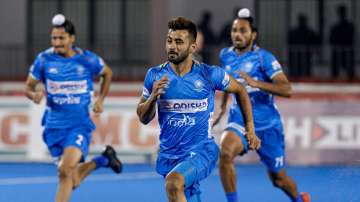 File photo of India hockey team captain Manpreet Singh (centre) warming up with teammates.