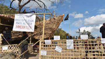 Placards and black flag are put up at the venue of Hornbill festival in solidarity with the civilians, killed in an anti-insurgency operation, in Kisama, Nagaland, Sunday, Dec 5, 2021.