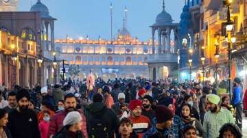 People not adhering to social distancing norms visit the Heritage street near the Golden temple, amid concern over rising cases of Omicron variant of COVID-19, in Amritsar.