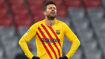 Barcelona defender Gerard Pique looks dejected after his team's UEFA Champions League group E exit w