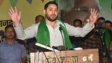 RJD leader Tejashwi Yadav addresses party workers in Patna.