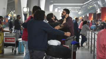 A passenger with her family and friends at the Terminal 3 of the IGI Airport in New Delhi.