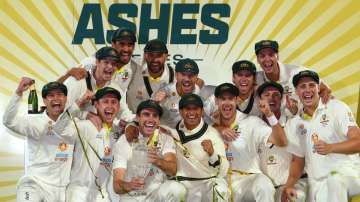 Australian team celebrating Ashes 2021-22 win against England.